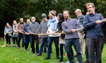 The London Sea Shanty Collective haul a rope at the Measuring of the Mayflower event