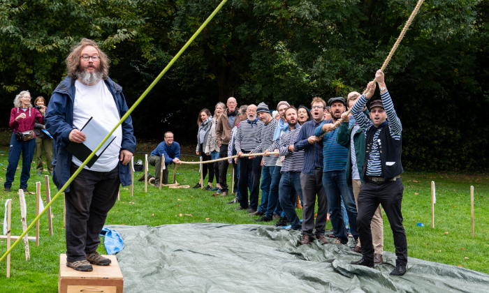 The London Sea Shanty Collective haul a rope at the Measuring of the Mayflower event